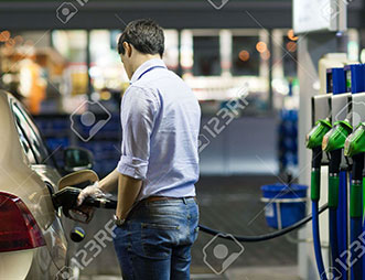 a guy is using diesel oil dispenser pump